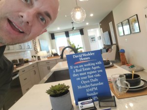 Rich Noto Realtor with builders sign. Never go alone to builder